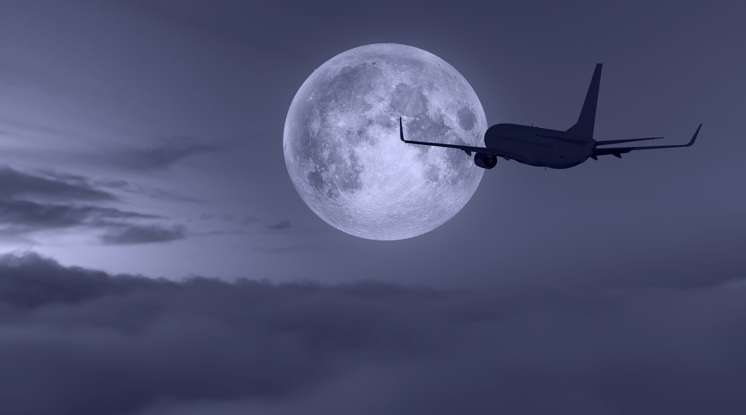 Passenger,Airplane,In,The,Sky,,Full,Moon,In,The,Background