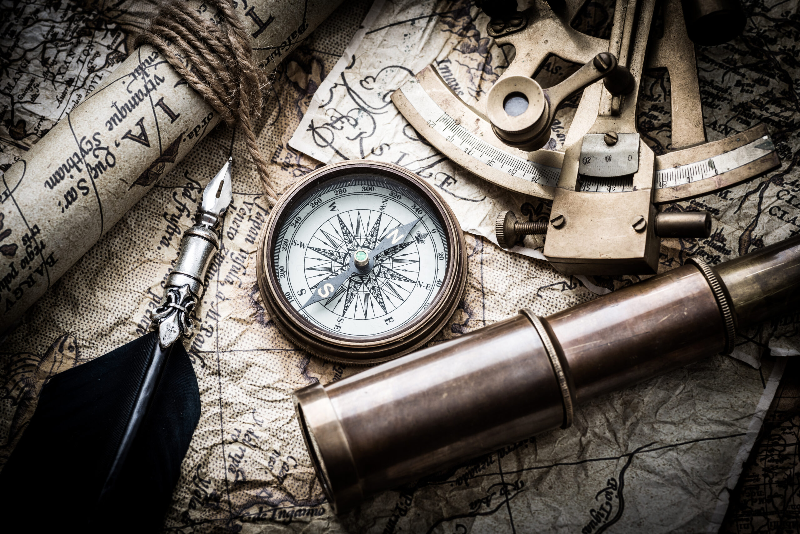 Vintage,Still,Life,With,Compass,sextant,Spyglass,And,Old,Map