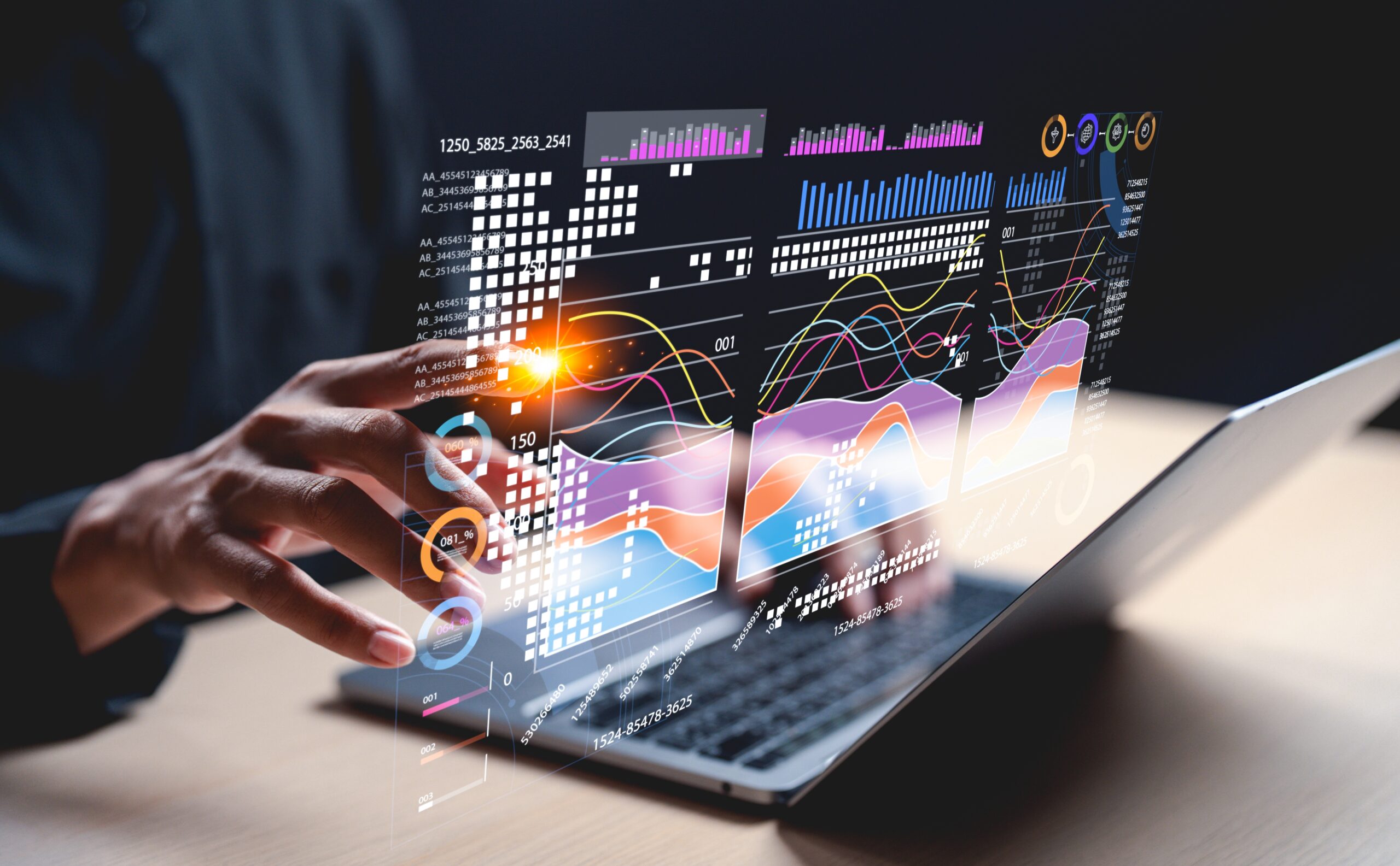 A,Hand,Interacts,With,Holographic,Data,Visuals,Above,A,Laptop,