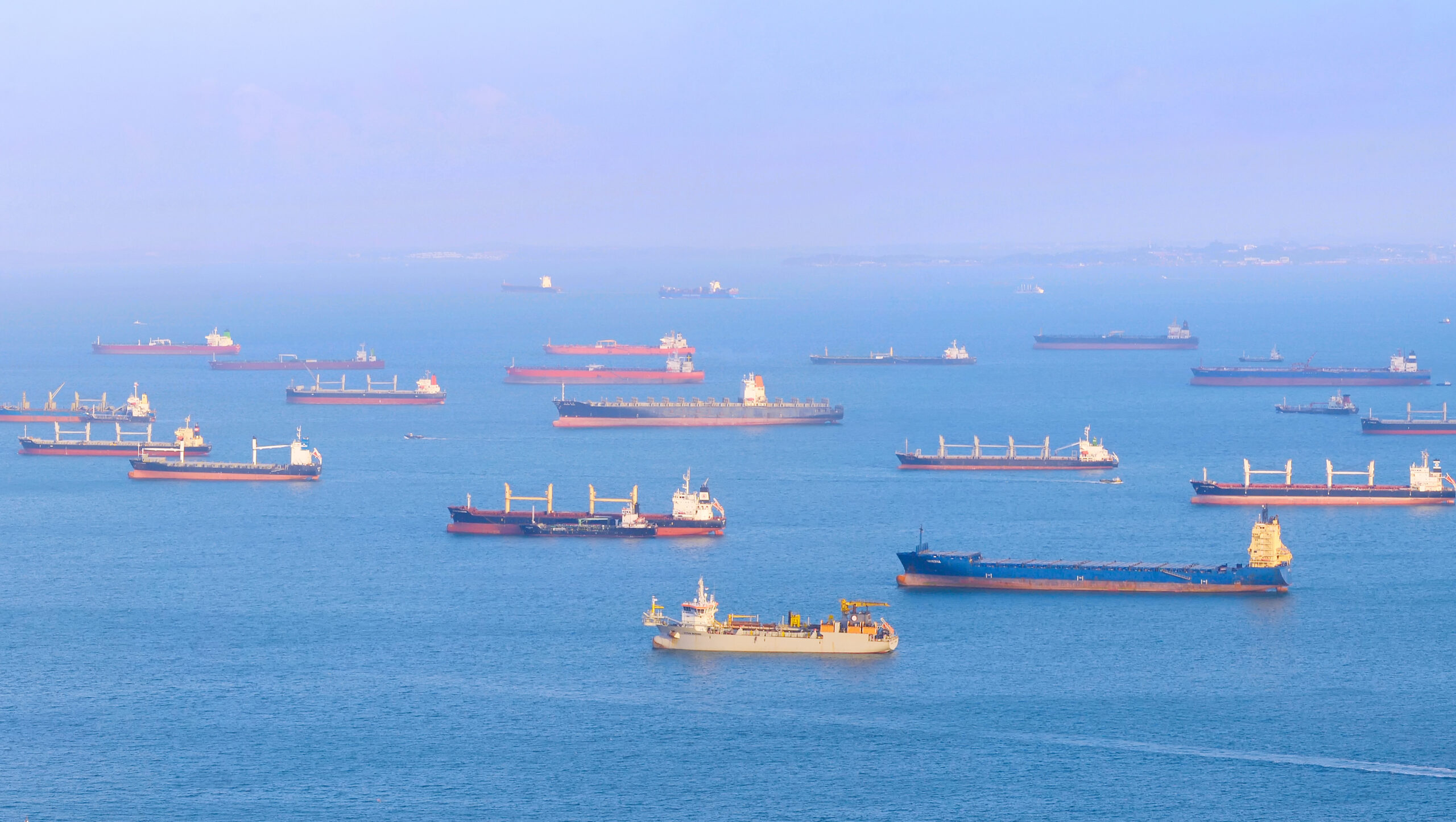 View,Of,Singapore,Harbor,With,Many,Cargo,Ships,At,Sunset.